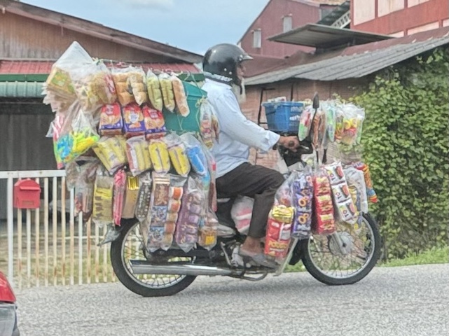 snack food vendor on a motorbike
